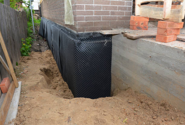 Happy homeowners after waterproofing job in Depew